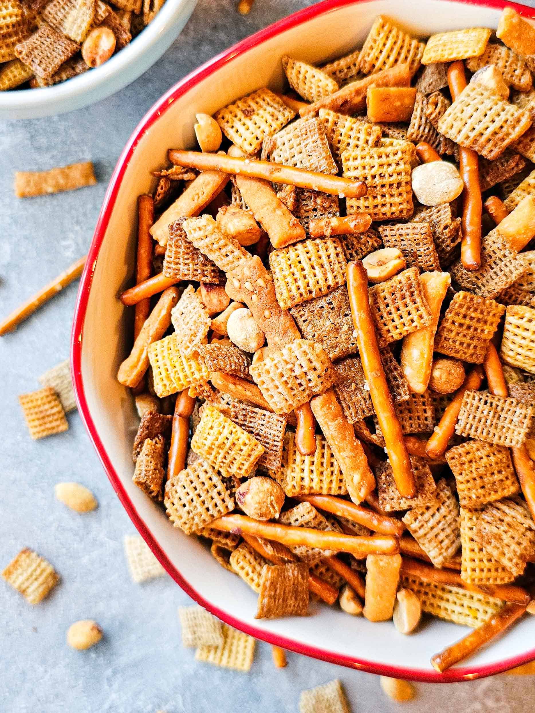 large bowl of snack mix with cereal and pretzels