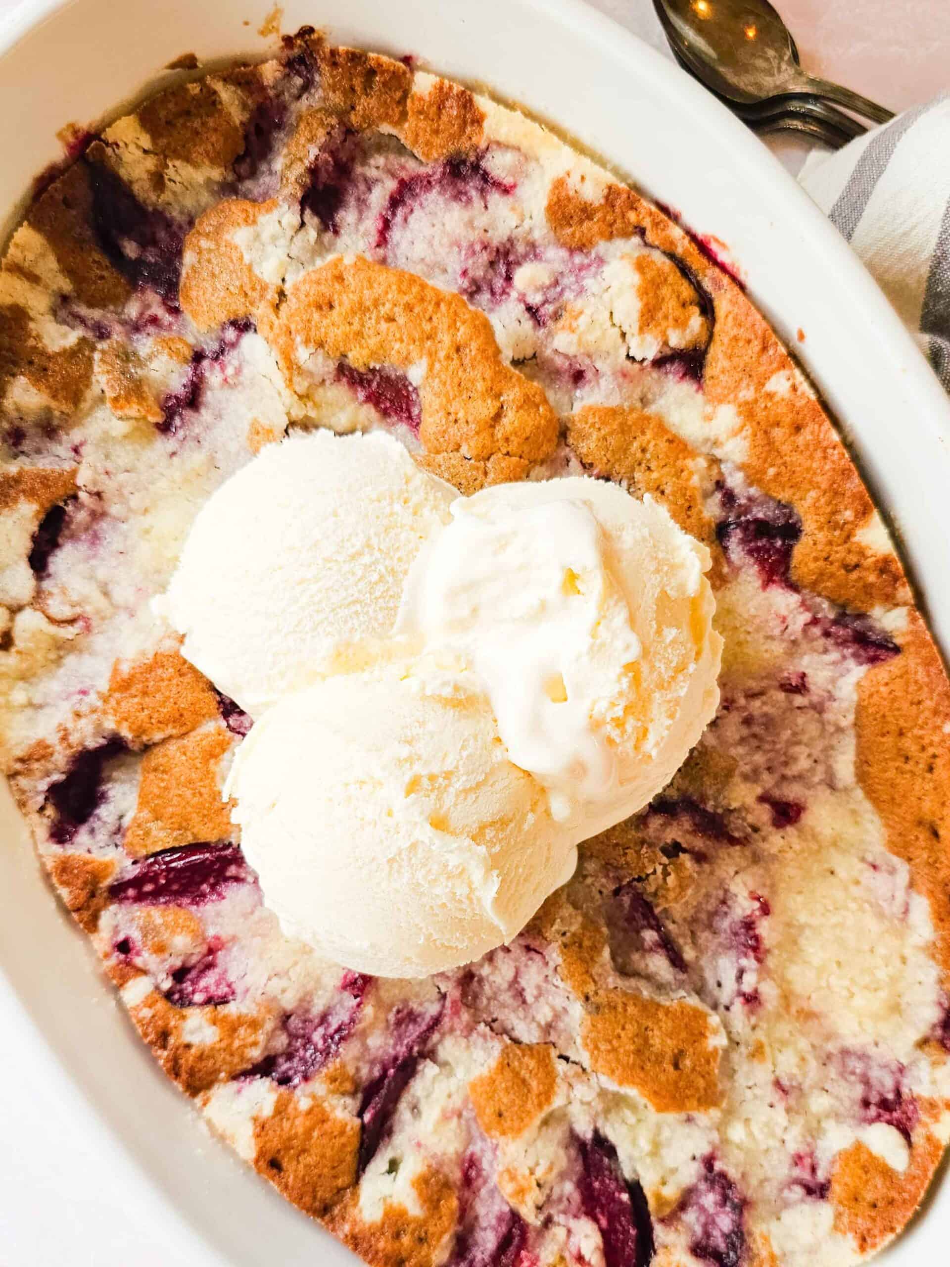 plum cake with scoops of ice cream