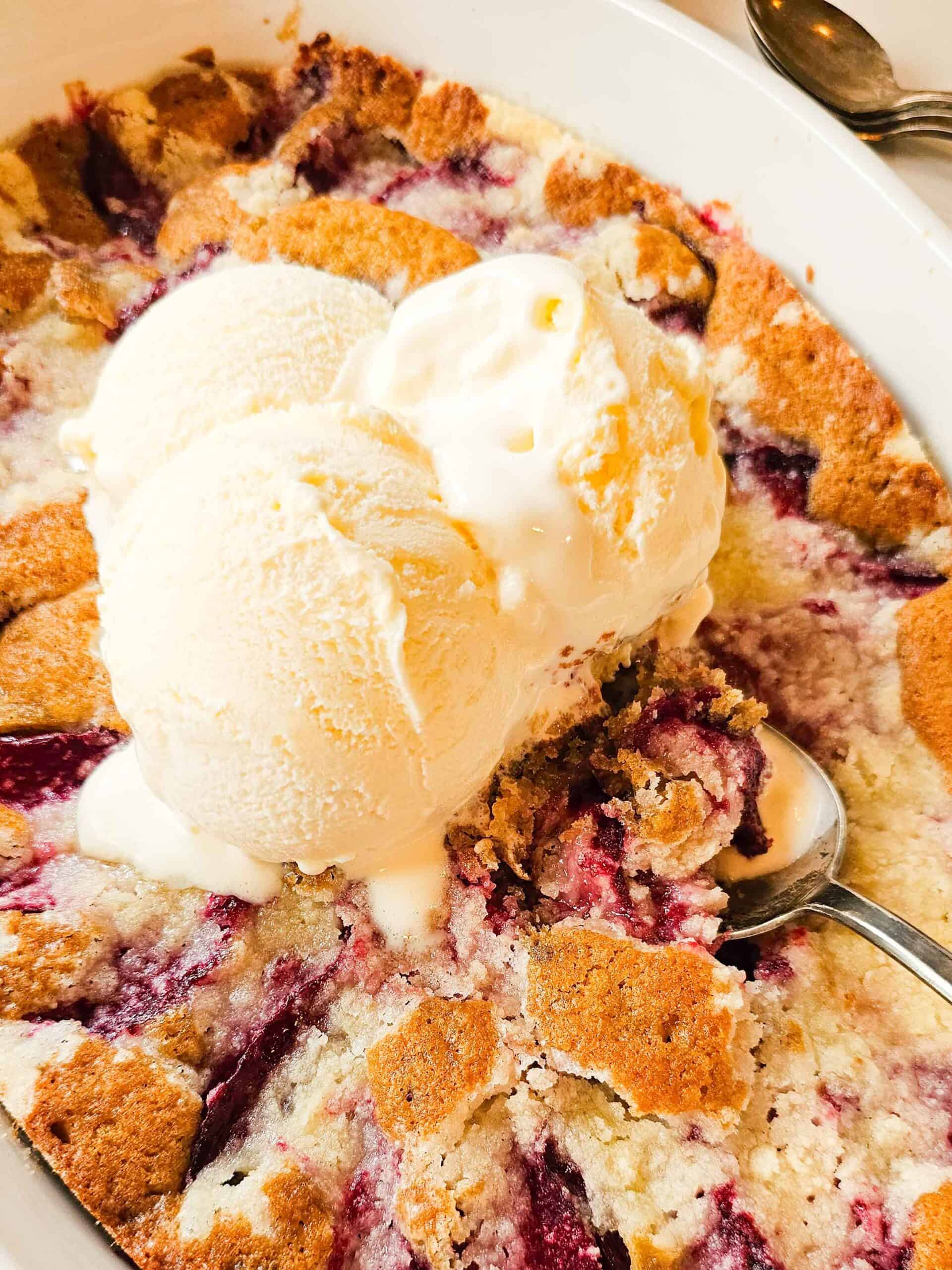 spoon dishing up a scoop of plum cake