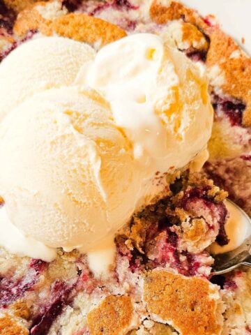 plum cake with ice cream on top