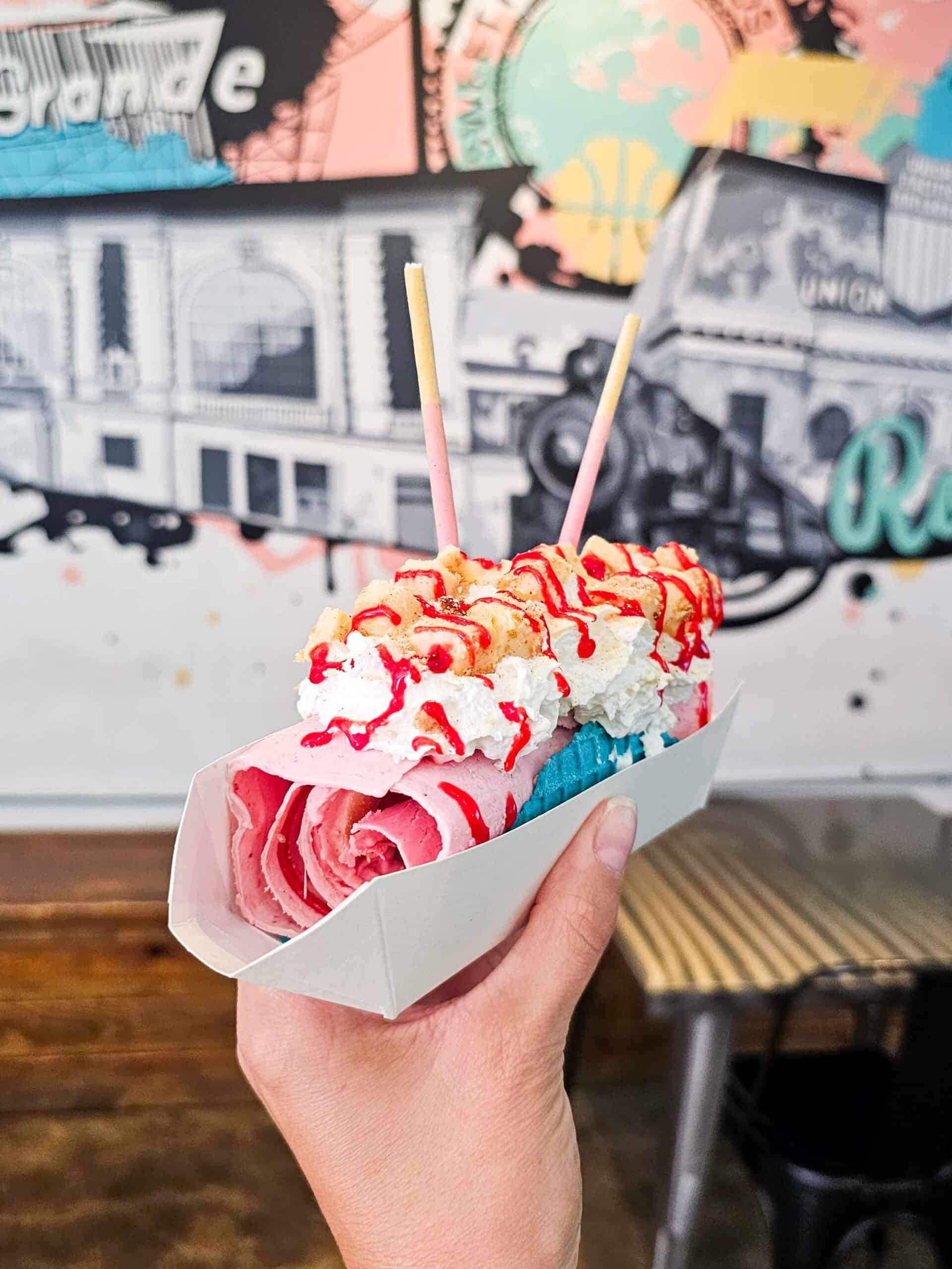 hand holding a rolled ice cream taco