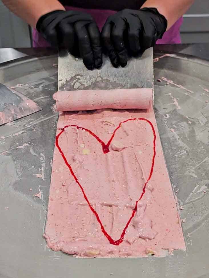 thin layer of ice cream with a pink glaze heart