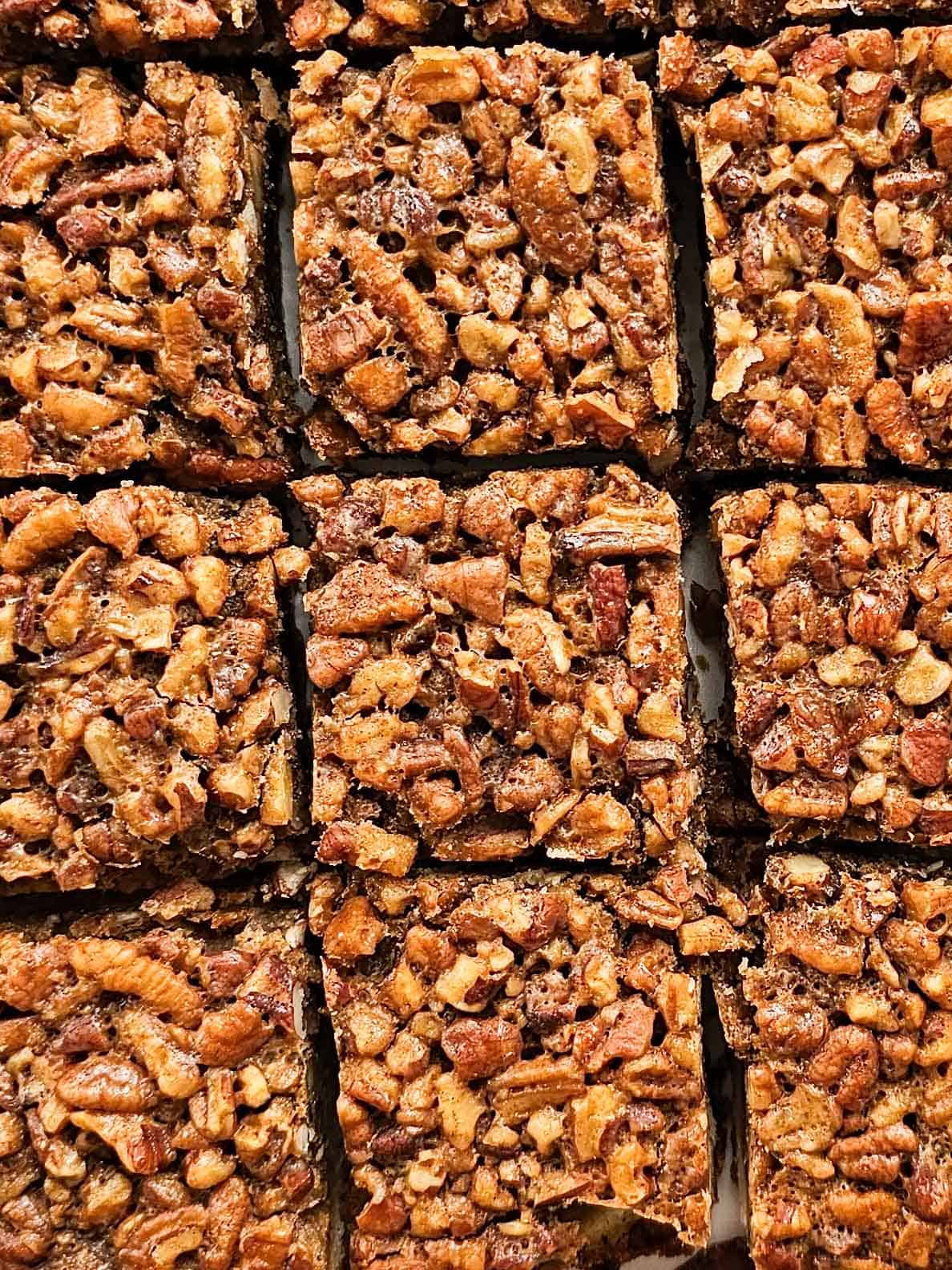 pecan pie bars on parchment paper