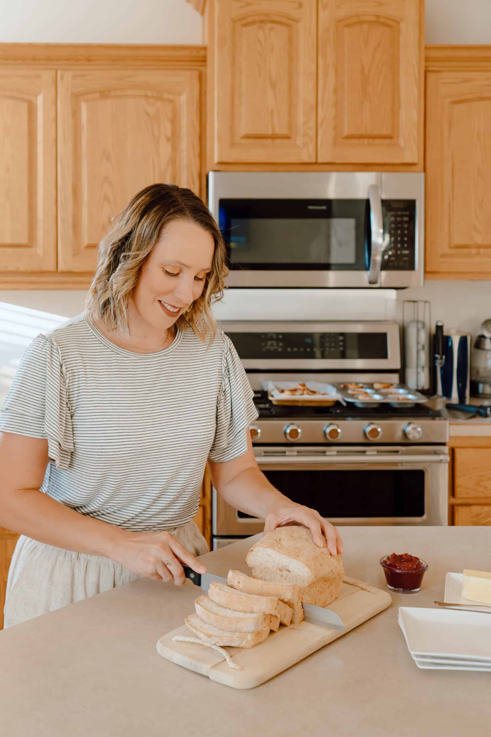 woman slicing bread in the kitchen